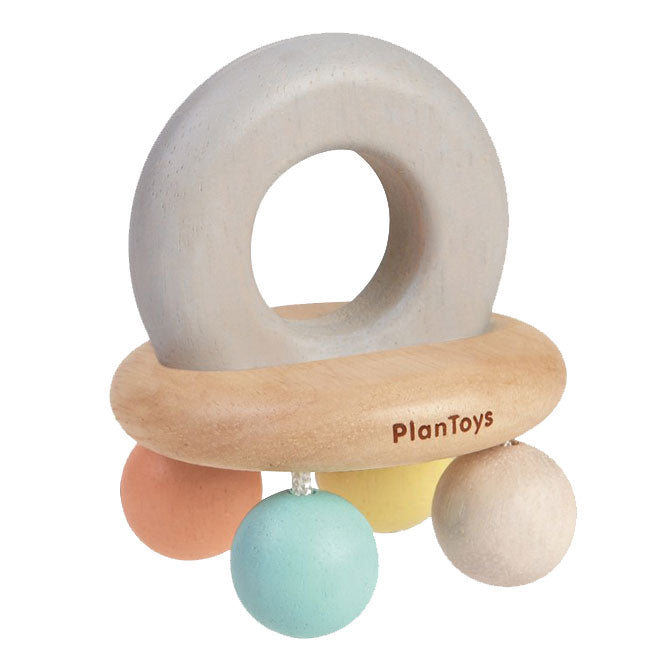 sonajero campana de madera, viene con un mango agarra-fácil y bolas sonajero. En colores pastel.