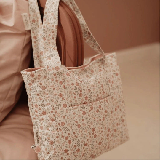 Little Dutch wrist bag with floral design hanging on a chair, delicate and feminine style