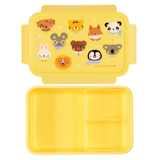 Intérieur de la boîte à lunch jaune avec compartiments pour les collations ou le déjeuner scolaire