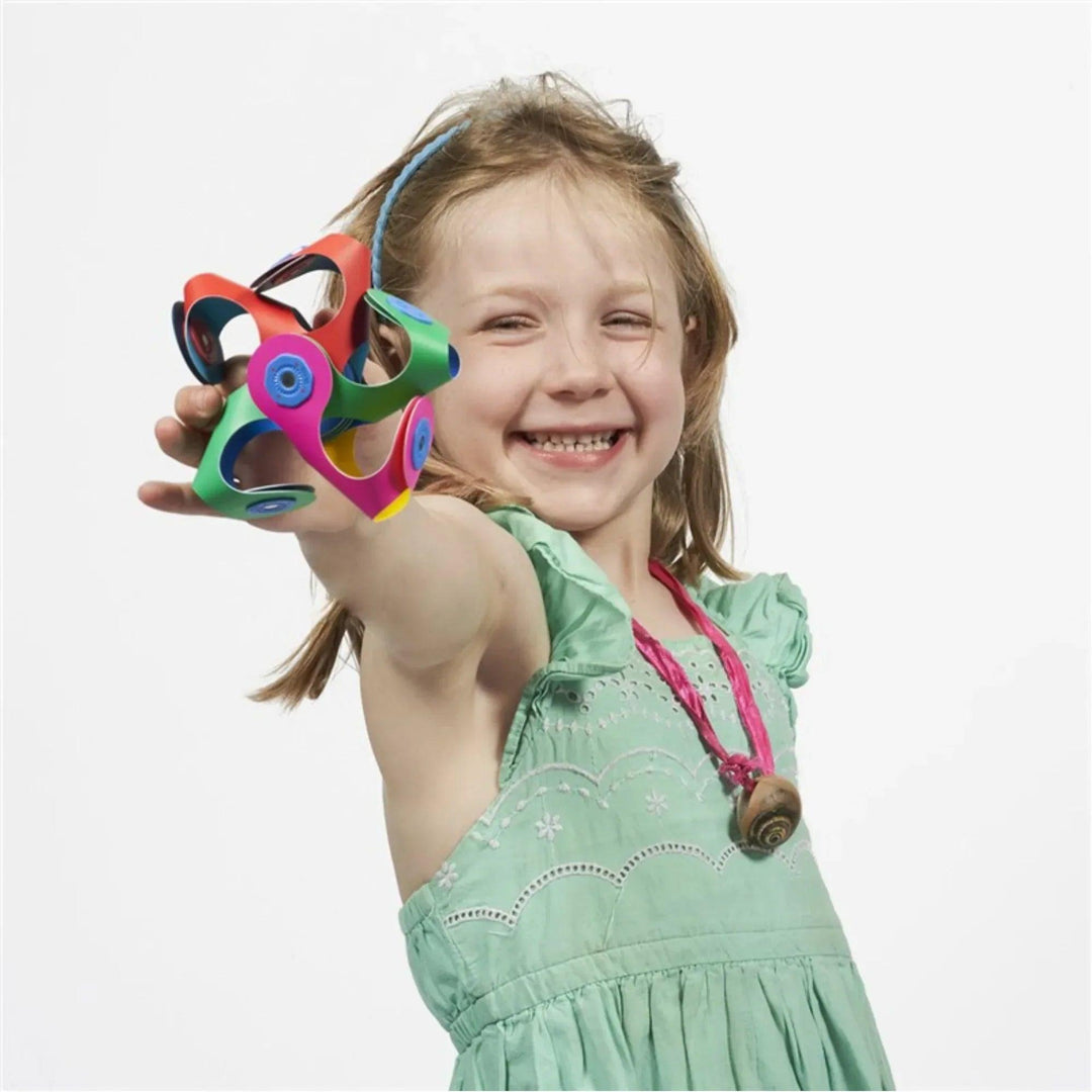Girl playing with Clixo colorful magnetic building toy