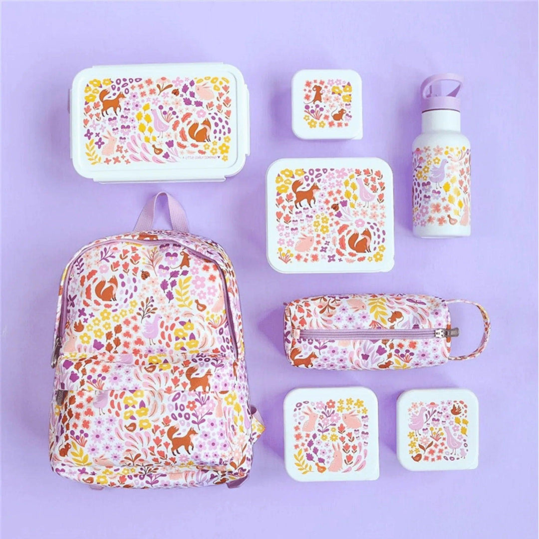 Colección infantil con fiambrera, mochila, estuche, botella y cajas de snacks con diseño floral y animalitos