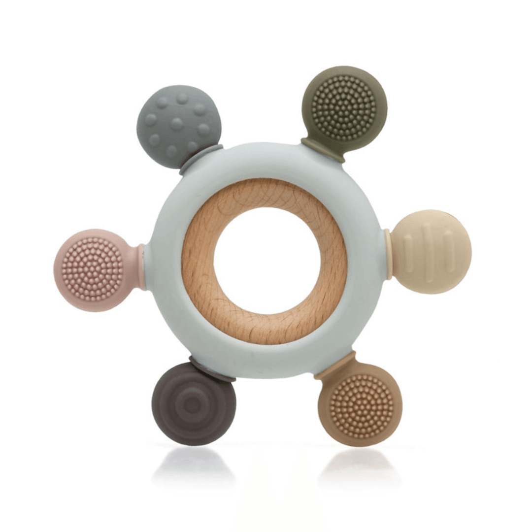 Baby teether with ring design, combination of natural wood and silicone with different textures to stimulate touch.