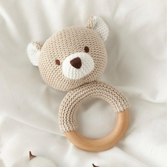 Baby amigurumi-style knitted teddy bear teether with wooden ring