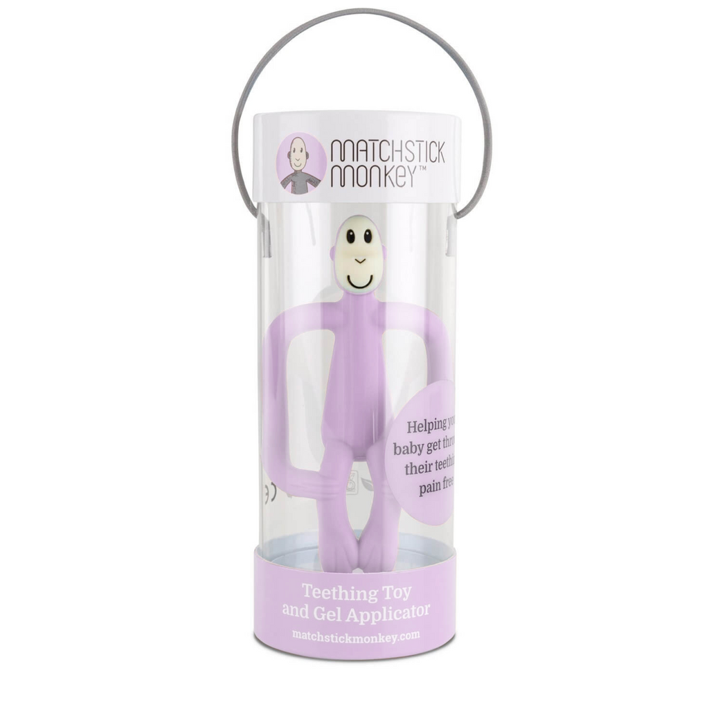 Mordedor Matchstick Monkey color lila en envase original cilíndrico, juguete de dentición y aplicador de gel