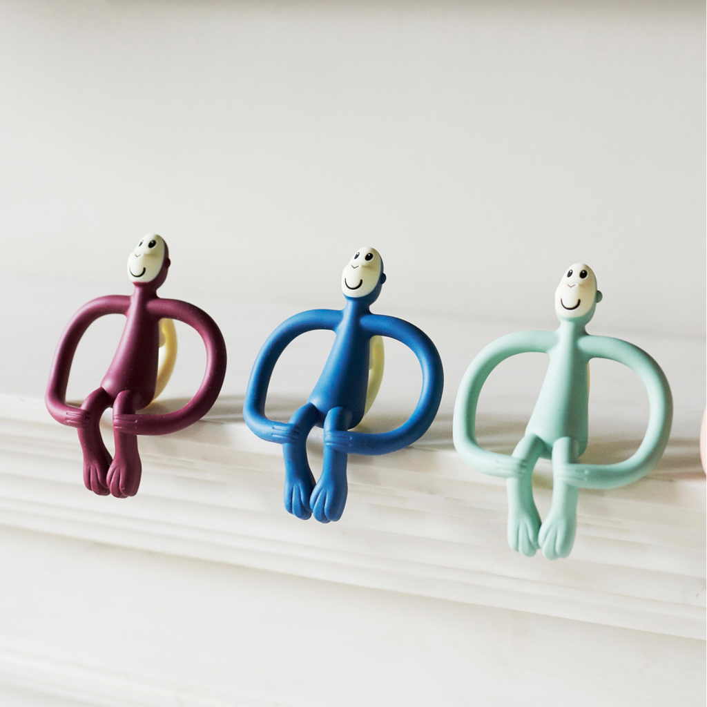 Mordedores Matchstick Monkey de silicona para bebé en colores azul, verde, rosa y burdeos