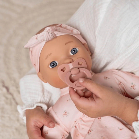 Baby doll Little Dutch with pink floral outfit and matching pacifier, ideal for children's symbolic play
