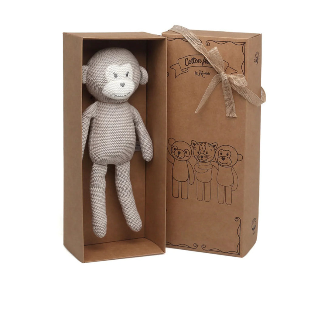 Knitted monkey doll presented in a kraft gift box for baby
