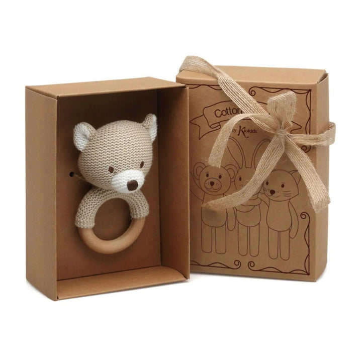 Knitted teddy bear teether with wooden ring presented in a gift box