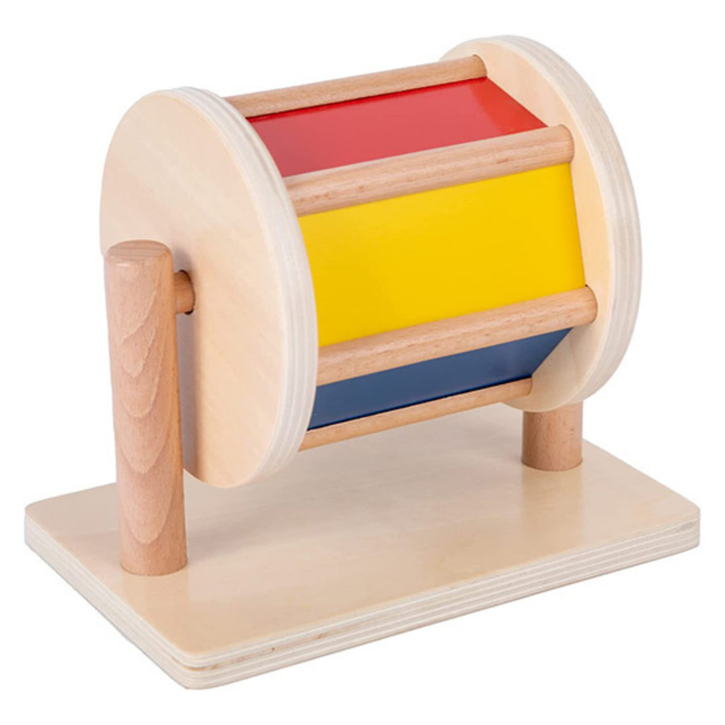 Tambor giratorio Montessori de madera con colores brillantes para estimulación sensorial.