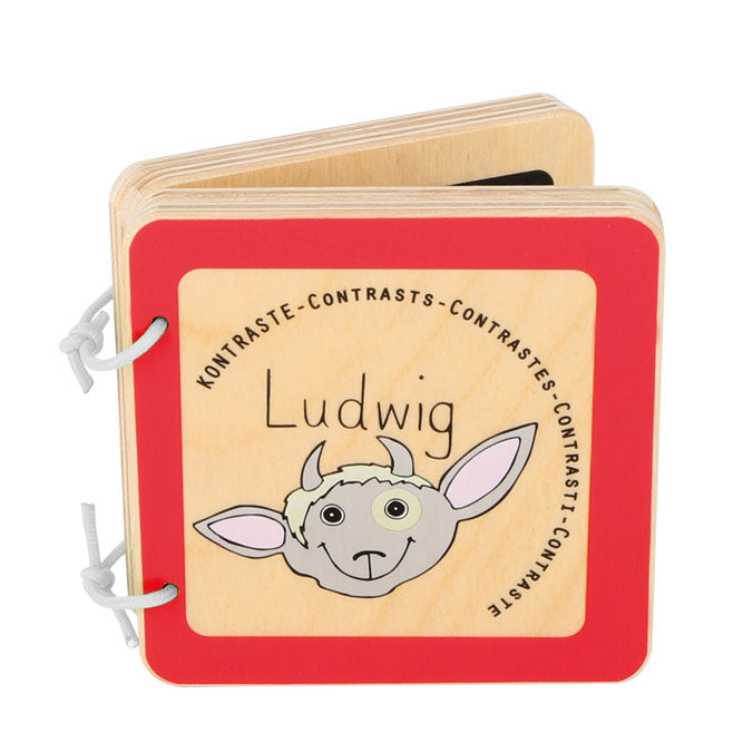 Libro de madera infantil. Se pueden explorar los primeros contrastes de blanco y negro junto con la divertida cabra Ludwig.