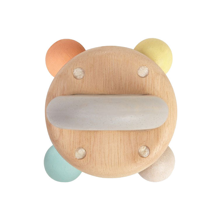 sonajero campana de madera, viene con un mango agarra-fácil y bolas sonajero. En colores pastel.