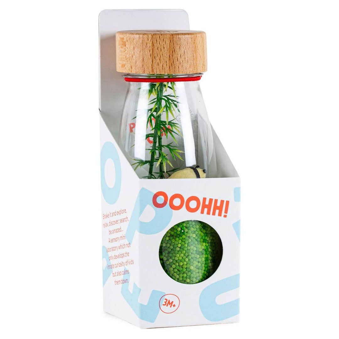Botella sensorial panda dentro de su caja