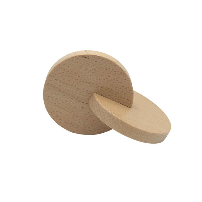 Juguete Montessori. Son dos discos de madera de haya entrelazados.