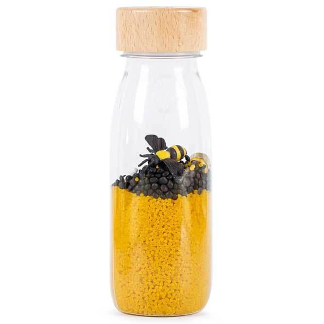 Bouteille sensorielle, à l'intérieur vous trouvez des abeilles et du pollen, créant un environnement.