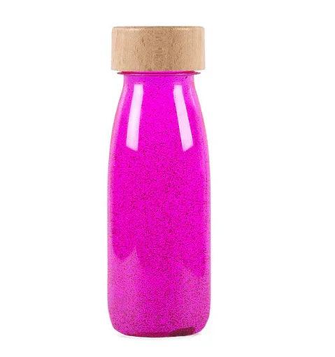botellas con pigmentos fluorescentes y fosforescentes de color fucxia