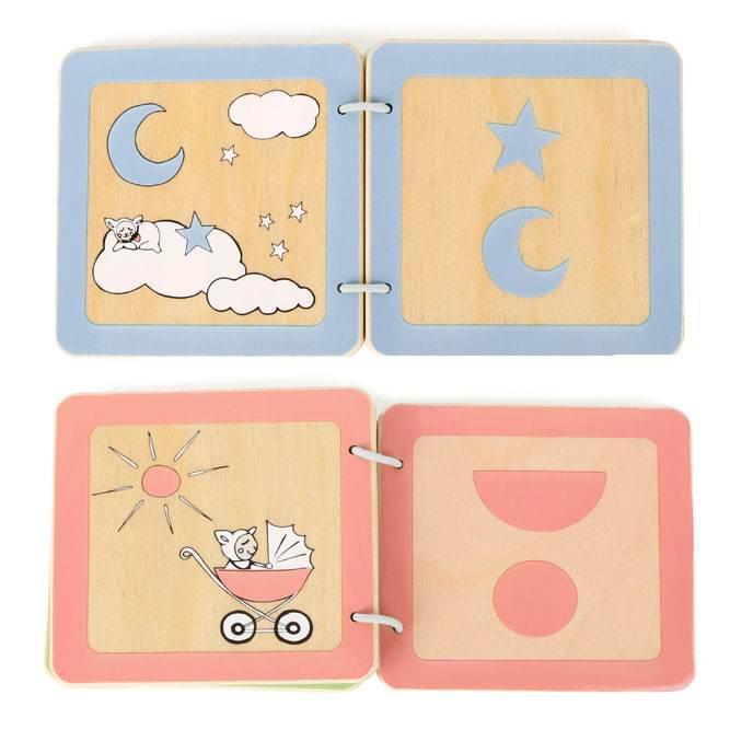 Pagine interne di un libro per bambini in legno con forme geometriche ad incastro e disegni illustrativi, ideali per l'apprendimento precoce