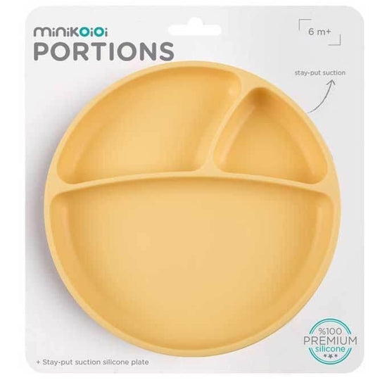 Silicone baby plate with three compartments in pastel yellow.