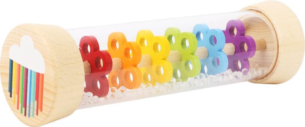 Giocattolo RAIN BAR, sonaglio. Per bambini da 0 a 1 anno. Lo stantuffo in plastica trasparente della barra antipioggia offre una visione chiara delle perle di vetro che filtrano attraverso le sei piastre colorate perforate a forma di fiore.